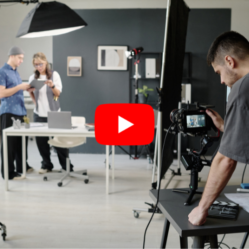 An example of a video production setup with camera, lighting equipment, and people in a room.